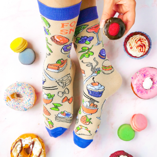 Food Snob Women's Crew Socks. Pilates? Thought you said pie and lattes! ──────────────── Size Women's shoe size 6-9 Men’s shoe size 4-7 EUR 37-41 ──────────────── Materials & Attributes 70% Combed Cotton, 28% Nylon and 2% Spandex. Reinforced stitching on toe to protect from wear. Print on Socks: "Food Snob" ──────────────── Care Machine wash and hang to dry. Do not iron or bleach.