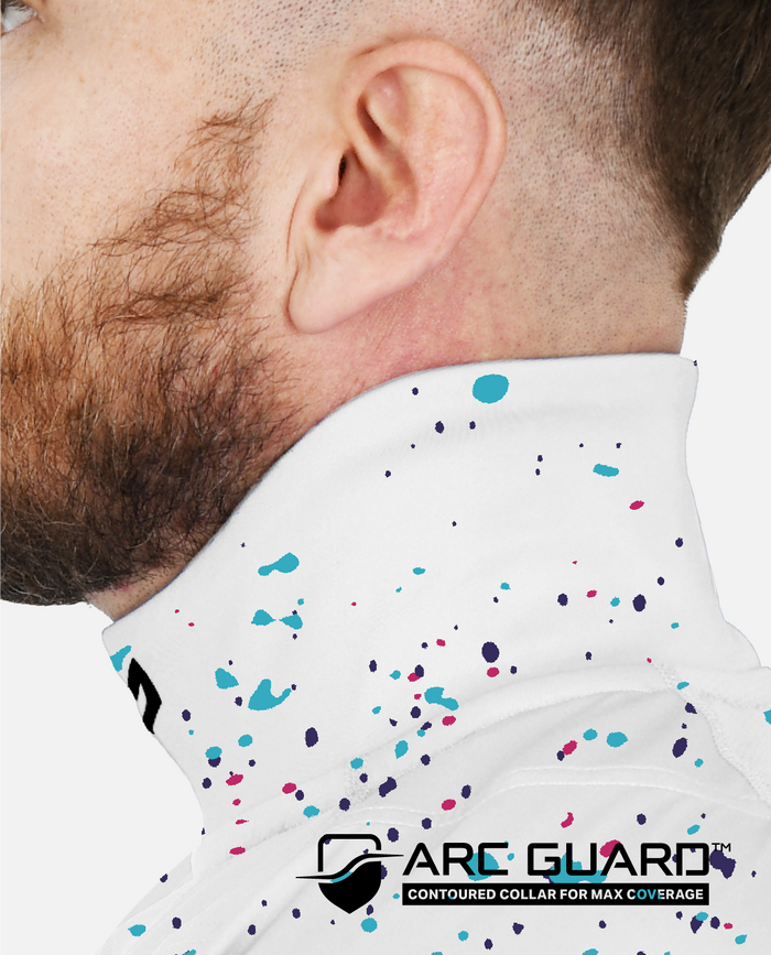 Close-up of a man wearing a white shirt with colorful speckles and 'Arc Guard' branding.