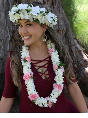 Double strand lei made with tuberose and carnation flowers