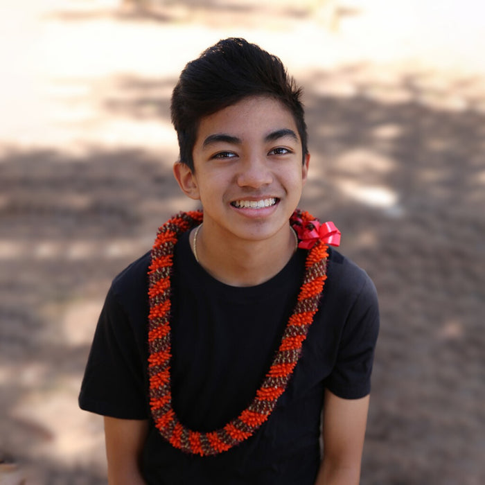 Traditional orange cigar lei with a pattern of natural orange and brown hue