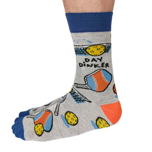 Gray Day Dinker socks featuring colorful pickleball paddles, balls, and nets with a blue cuff and toe design